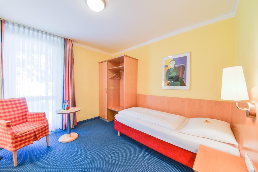 Hotel Beim Schrey Kirchheim bei Muenchen Pokoj fotografie